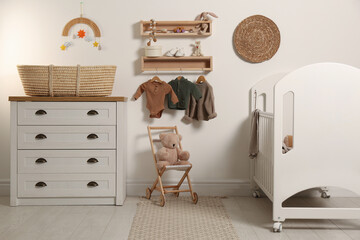 Poster - nursery interior with stylish furniture, clothes and accessories