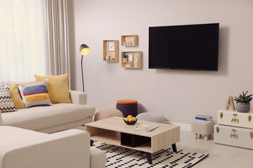 Sticker - Modern TV, comfortable sofa and decor elements in living room