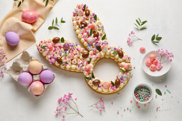 Wall Mural - Composition with beautiful cake and painted eggs for Easter celebration on light background