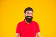 © be free - confident and handsome bearded man on yellow background. hair and beard care.