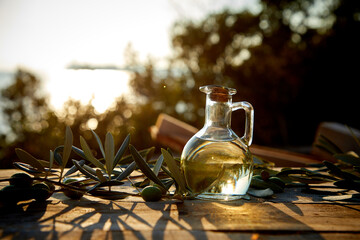 Wall Mural - olive oil and green olives on the table