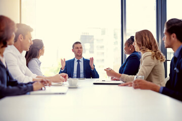 Aufkleber - Our focus should always be to go bigger and better. Shot of a group of businesspeople having a meeting in an office.