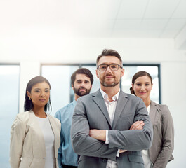 Canvas Print - Were prepared for any challenge. Portrait of a group of businesspeople standing together in a modern office.