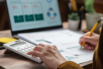 Poster - close up hand using calculator calculate tax and budget of project at home