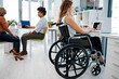 © Mikolette M/peopleimages.com - She never misses a day at the office. Shot of a businesswoman sitting in her wheelchair while working at her desk.