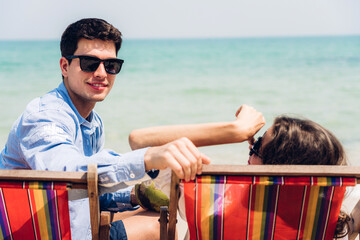 Wall Mural - Vacation romantic love young happy smile couple in honeymoon travel holiday trip on sand at blue sky sea beach having fun and relaxing together on tropical beach.Summer travel