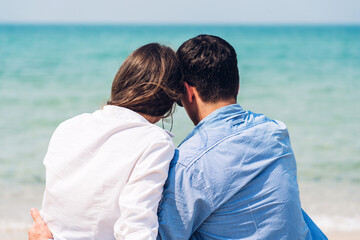 Wall Mural - Vacation romantic love young happy smile couple in honeymoon travel holiday trip on sand at blue sky sea beach having fun and relaxing together on tropical beach.Summer travel