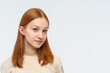 © Chiralli - Close up portrait of Red-haired teenage girl looking at camera. Cute teenage girl woman face closeup portrait with healthy clean skin isolated on white background. Copy space.