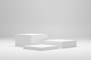Blank white podium platforms or pedestals with white background for product display. Empty stands for showing or presenting products.