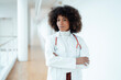 © Westend61 - Confident healthcare worker with arms crossed at medical clinic