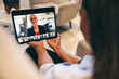 © Jacob Lund - Businesswoman attending a virtual meeting with her global partners