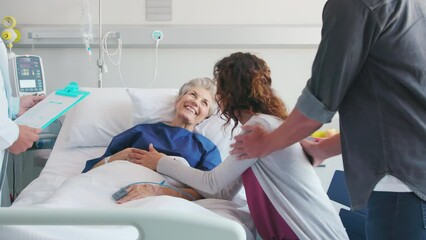 Wall Mural - Happy family at hospital with doctor