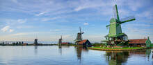 Panoramic View Of A Couple Of Dutch Windmills