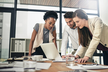 Poster - They have a strong sense of purpose. Shot of a team of businesspeople using a laptop together at work.