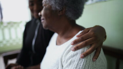 Wall Mural - A teen granddaughter taking care of grandmother giving help and support