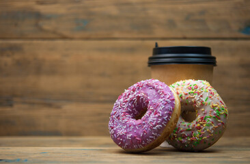 Wall Mural - Glazed donuts on wooden background