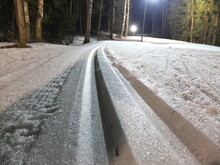Cross-country Ski Track On The Night Forest. Selective Focus.