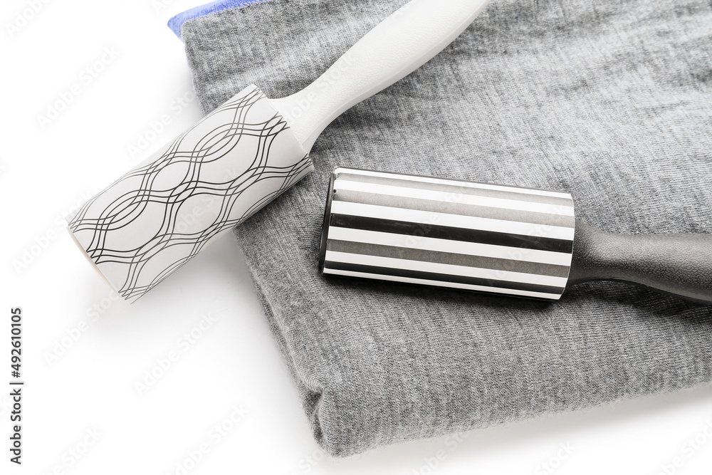New lint rollers with clothes on white background