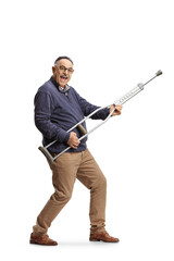 Poster - Happy mature man playing guitar on a crutch