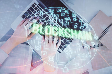 Poster - Double exposure of woman hands working on computer and blockchain theme hologram drawing. Top View. bitcoin cryptocurrency concept.