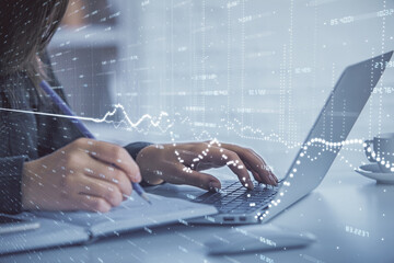 Fototapete - Double exposure of businesswoman hands typing on computer and forex graph hologram drawing. Financial analysis concept.
