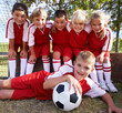 Leinwandbild Motiv The team photo. Portrait of a childrens soccer team posing for the team photo.