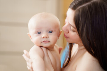 Wall Mural - beautiful and gentle naked mom and baby 