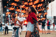 © Zamrznuti tonovi - Two beautiful friends drinking beer and having fun on a music festival