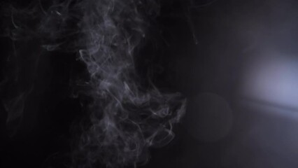 Wall Mural - flowing fog mist haze glare smoke on black background