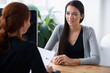 © Nicola Katie/peopleimages.com - Tell me something about yourself thats not in your resume. Shot of two young professionals having a discussion at a desk.