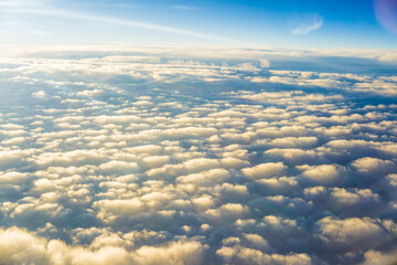 Wall Mural - Fluffy cloud with blue sky aerial view from airplane