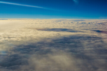 Wall Mural - Fluffy cloud with blue sky aerial view from airplane