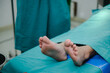 corpse foot on hospital table, health care medicine concept and life death insurance business