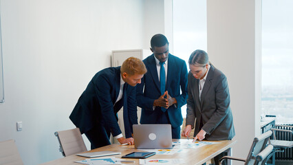 Wall Mural - Young multiracial business people enjoying working together at office