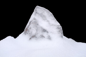 Sticker - natural stone in snow isolated on black background