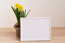 Portrait Picture Frame Mockup With Yellow Daffodils In Natural Decorated Pots.Ecofriendly Life
