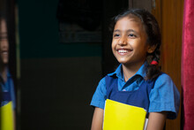 Portrait Of A Young School Girl Smiling