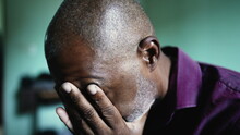 A Worried Senior Black Man Praying To God Seeking Help