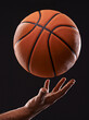 © Duncan M/peopleimages.com - Time to raise your game. Cropped image of a mans hand holding a basketball against a black background.