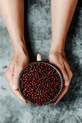 Wall Mural - man grabs an enamel pot full of adzuki beans