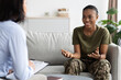 © Prostock-studio - Happy Black Soldier Woman Talking To Female Therapist During Meeting In Office
