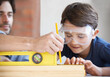 © Tylan E/peopleimages.com - Carpentry is a family profession. A father and son doing woodwork together.