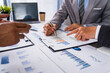 © crizzystudio - Business team presentation meeting Asian Men Finance Executive discusses meetings to plan work, investment projects, and trading strategy for trading partners. Finance and Accounting