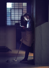 Aufkleber - Checking his schedule for tomorrow. Shot of a young man working late on a digital tablet in his coffee shop.