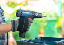 Hand Of Man Holding Cordless Screwdriver. Power Tool.