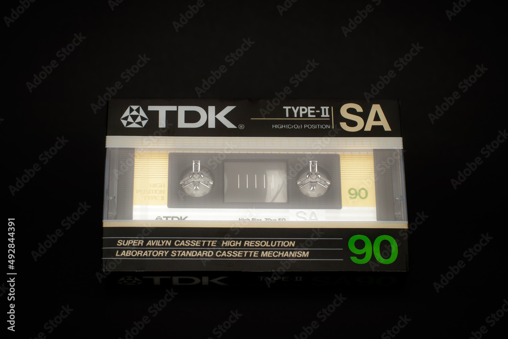 TDK SA 90, old vintage audio cassette on black background. Retro