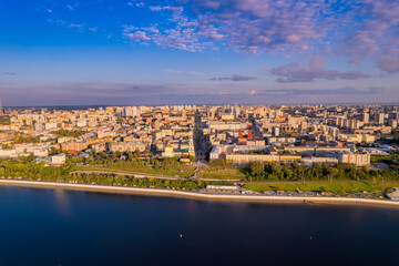 Wall Mural - Aerial top view panorama city Perm and central embankment of Kama river Russia, sunset drone photo