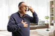 © Ljupco Smokovski - Mature man using an inhaler at home