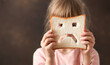 diet celiac gluten free sad bread in the hands of a child. Gluten free concept 