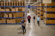 © Raymond Forbes LLC/Stocksy - Business Teamwork  meeting  E-Commerce Warehouse